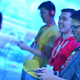 Three E3 attendees are gaming.